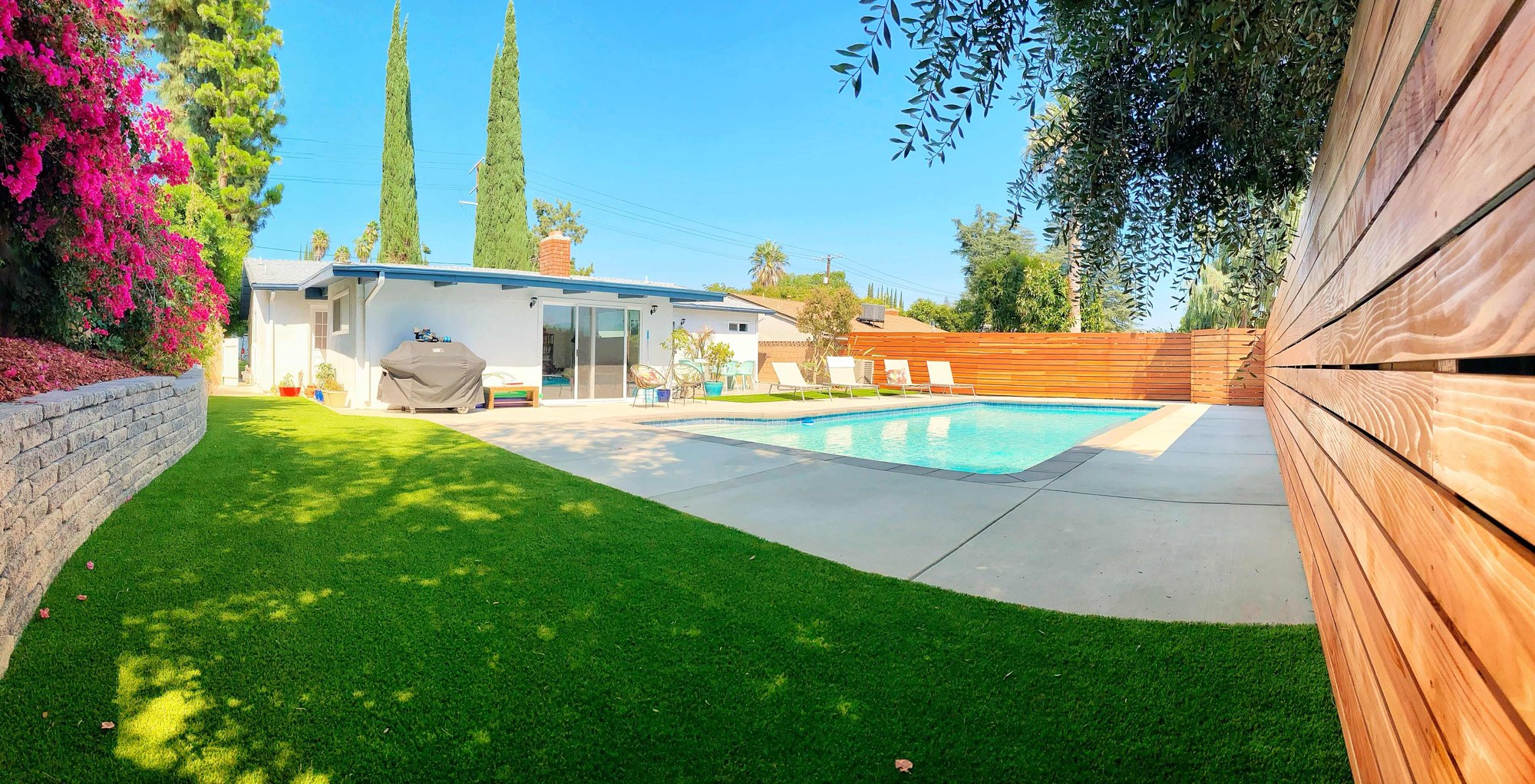 renovated bacyard with fence and retaining wall-1